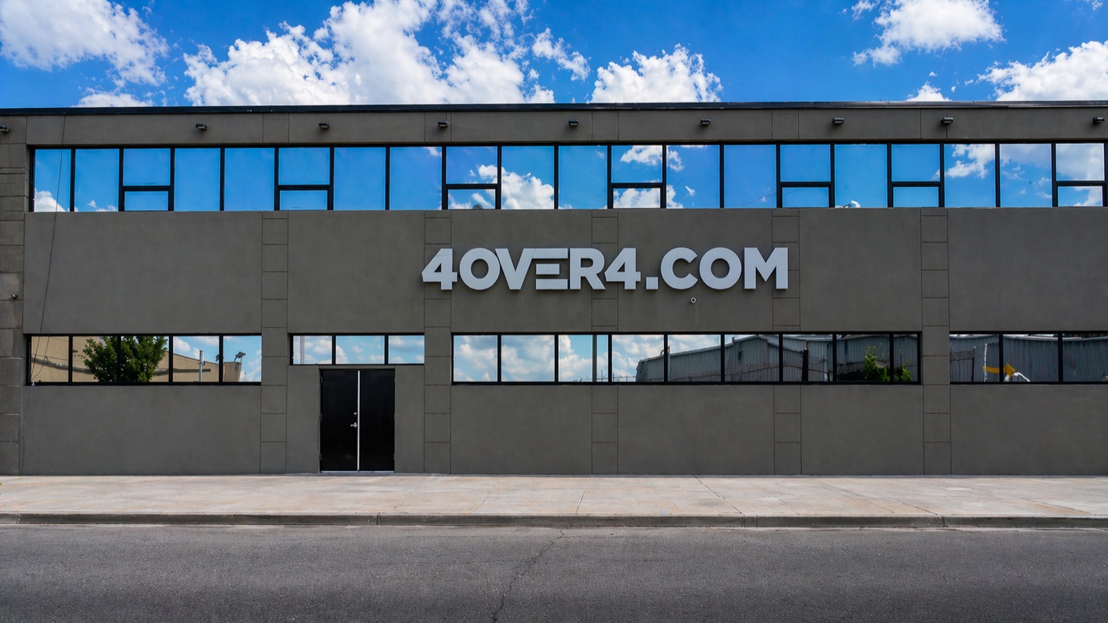 4OVER4.COM storefront in Queens, New York during the day