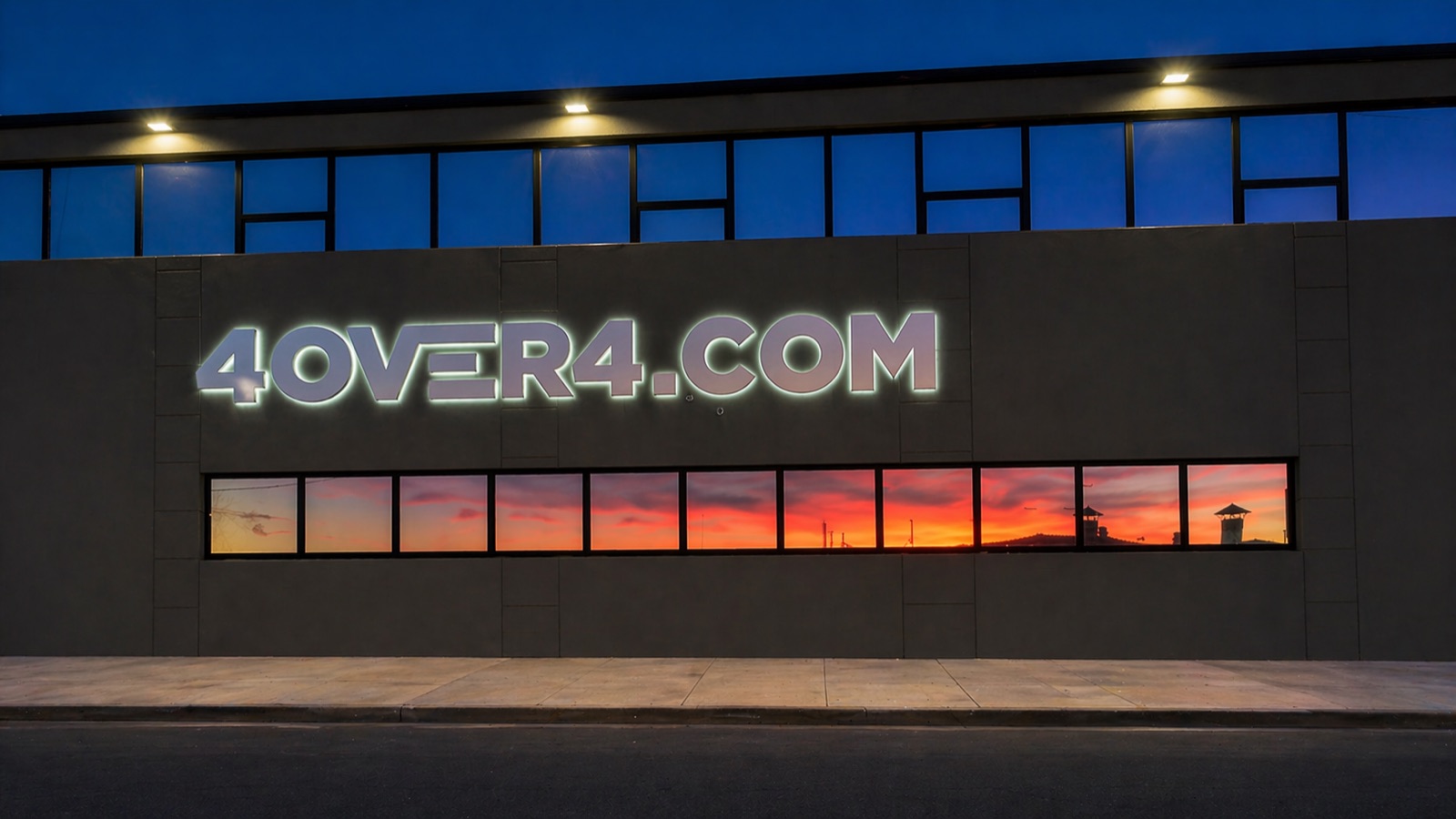 4OVER4.COM illuminated storefront in Queens, New York at night