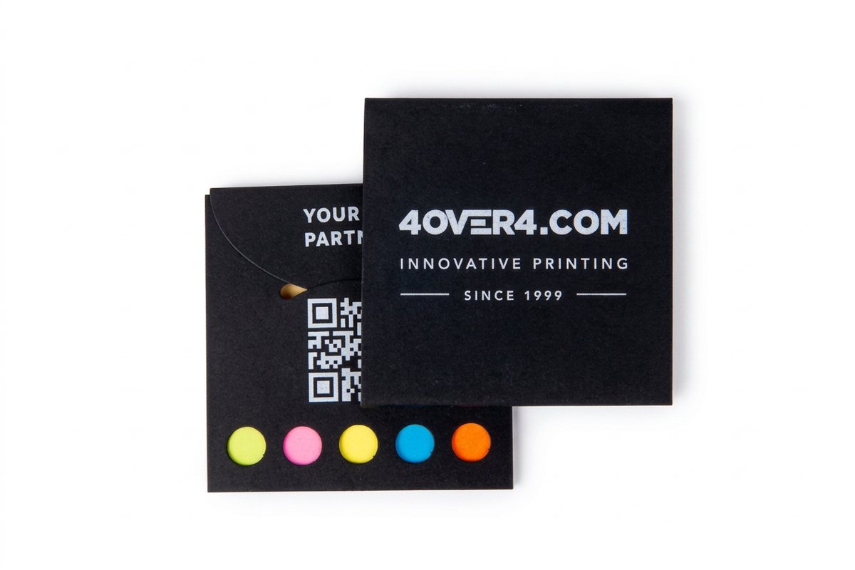 Pocket Stickies pads printed by 4OVER4, showing how small a genuinely pocket sized print format is in the hand