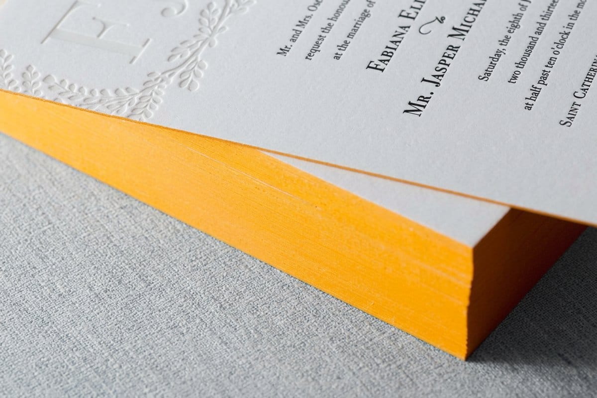Edge painted postcards from 4OVER4 on thick stock with colored edges visible in the stack