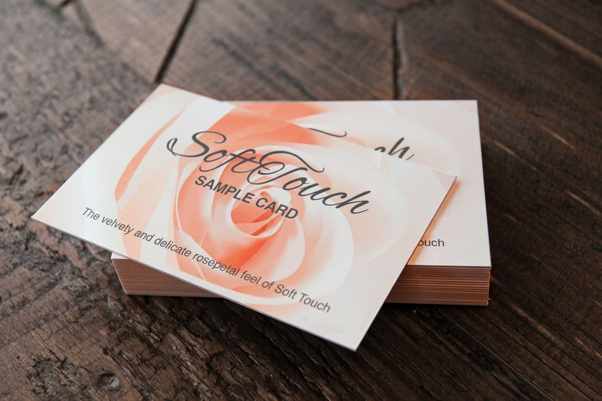 Soft touch business cards printed by 4OVER4.COM showing a velvety matte surface
