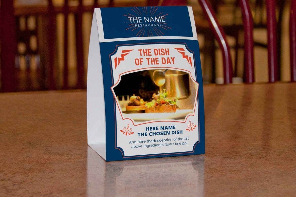 Custom printed table tents from 4OVER4.COM standing on a restaurant table