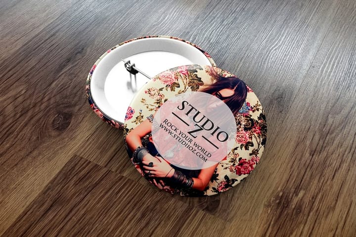 Standard pin-back buttons printed by 4OVER4 as a grand-opening giveaway