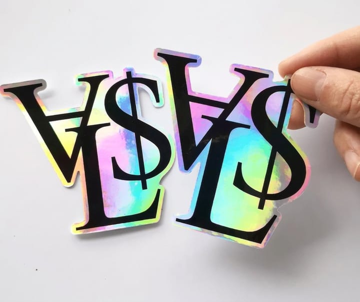 Custom Holographic Stickers from 4OVER4, part of a cannabis dispensary packaging set