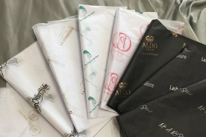 Custom tissue paper printed by 4OVER4 wrapping gift shop purchases
