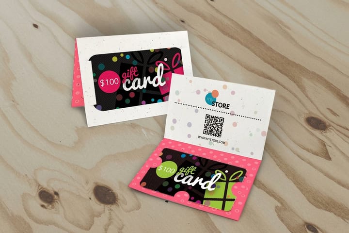 Gift card holders printed by 4OVER4 sleeving steakhouse gift certificates