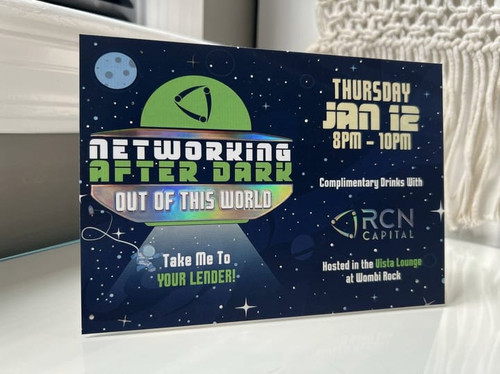Raised holographic postcards printed by 4OVER4 stacked with the printed face showing