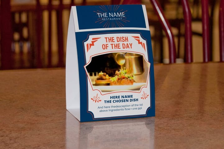 Table tents printed by 4OVER4 standing on a tasting room table promoting a wine club