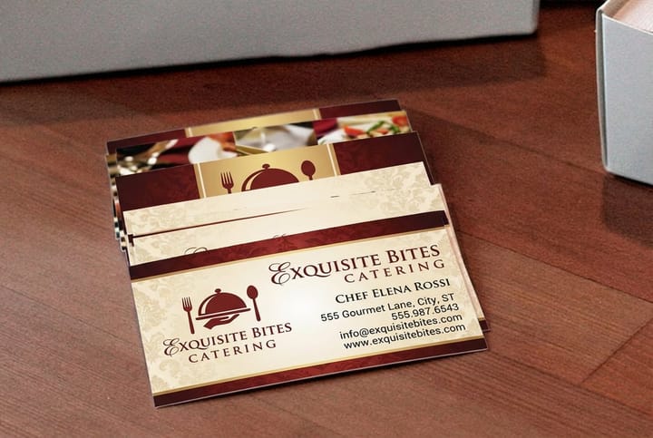 Catering business cards printed by 4OVER4 in a stack ready to hand to event planners