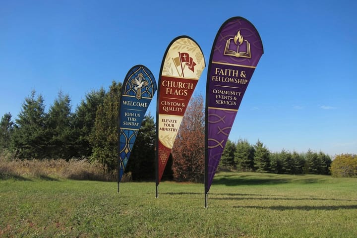 Church feather flags printed by 4OVER4 marking a church entrance
