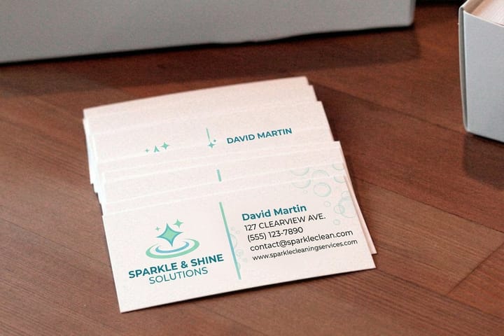 Cleaning business cards printed by 4OVER4 stacked and ready for estimates