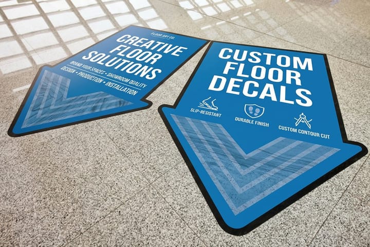 Floor decals printed by 4OVER4 guiding customers through a car wash lobby
