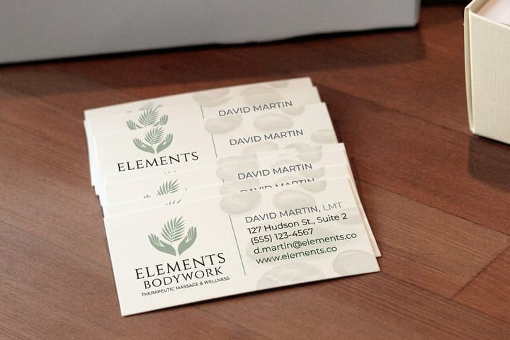 Massage business cards printed by 4OVER4 in a calm palette for a therapy practice