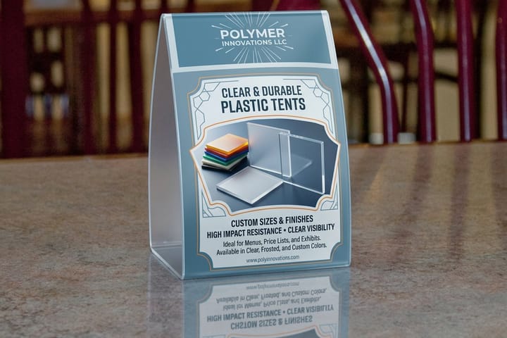 Plastic table tents printed by 4OVER4 with bottle service specials on a nightclub table