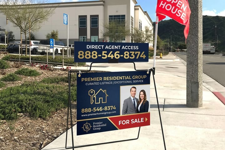 Real estate A-frame sign printed by 4OVER4 directing traffic to an open house