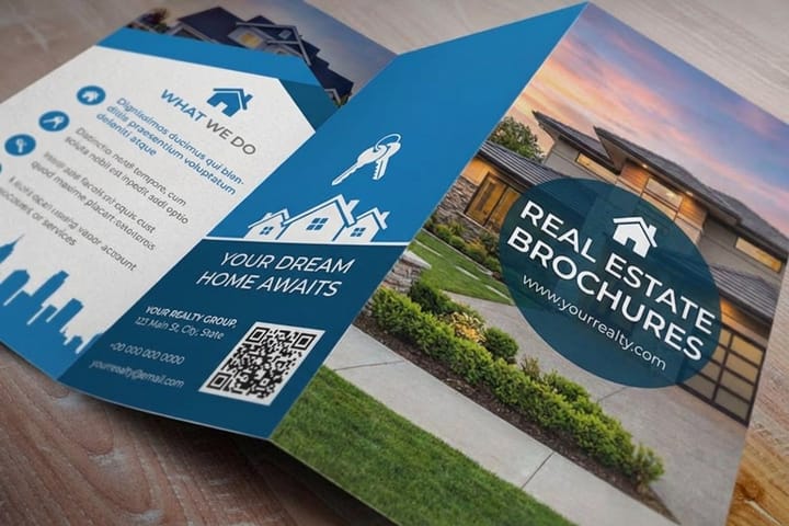 Real estate property brochures printed by 4OVER4 fanned at an open house