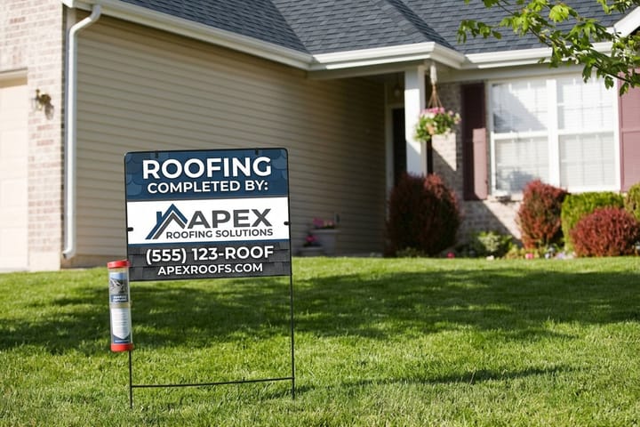 Roofing yard sign printed by 4OVER4 on the lawn of an active job