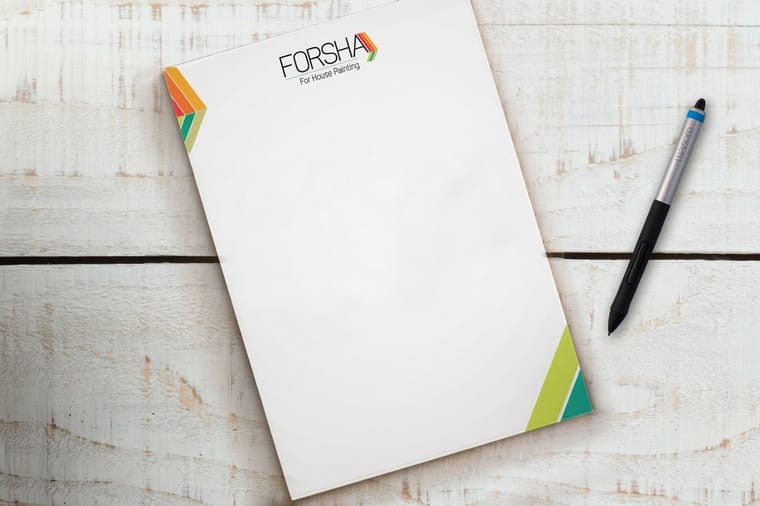 Custom notepad printed by 4OVER4 with a branded full-color header