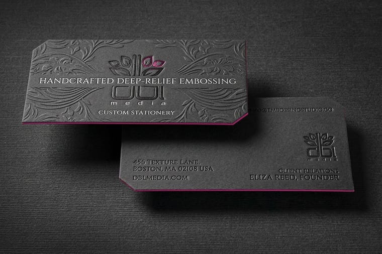 Embossed and debossed business cards printed by 4OVER4