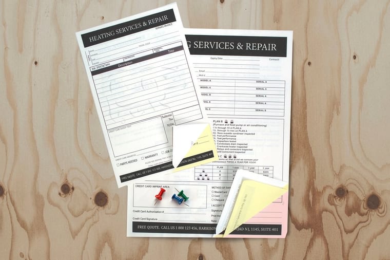 Carbonless NCR form sets printed by 4OVER4 with white, canary, and pink parts