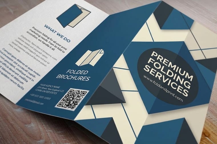 Folded brochures from 4OVER4 showing clean scored folds, a core print finishing technique