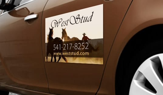 Vehicle with a car magnet advertising graphic printed by 4OVER4