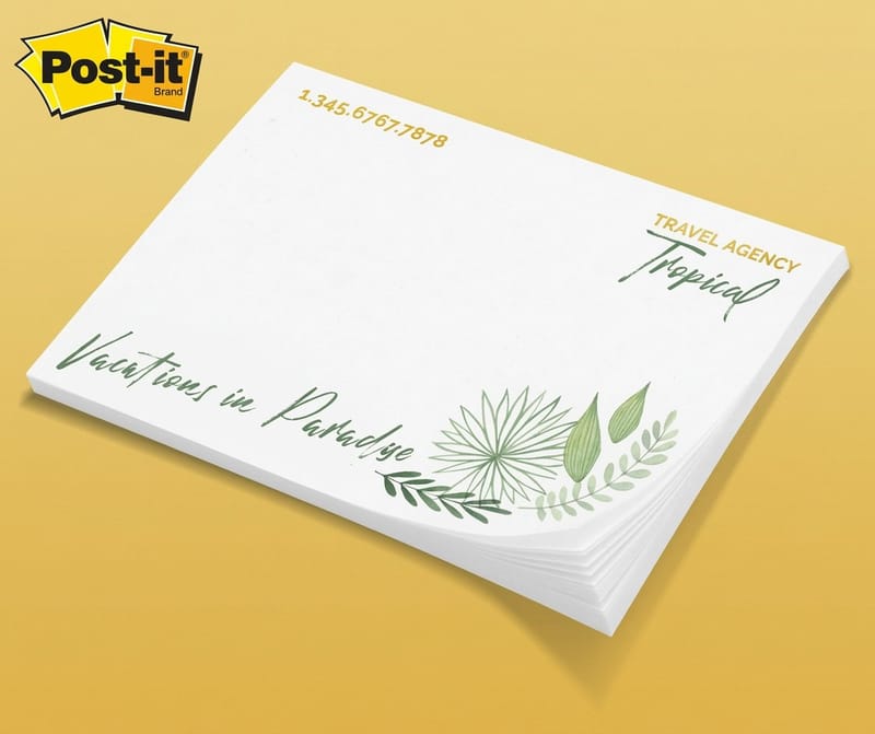 Branded sticky note pads from 4OVER4 on a reception desk and in a client welcome kit