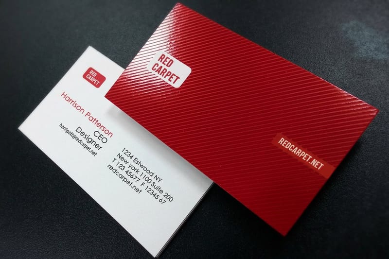Spot UV business card printed by 4OVER4 with a glossy pattern catching the light, a finish inspiration example