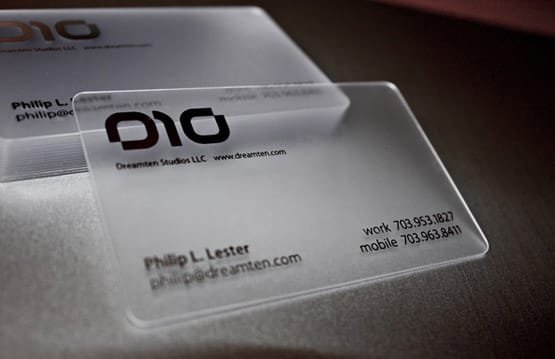 Stack of clear plastic business cards showing credit-card thickness