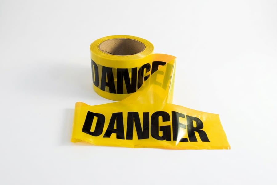 Printed barricade tape strung across a restricted area, printed by 4OVER4