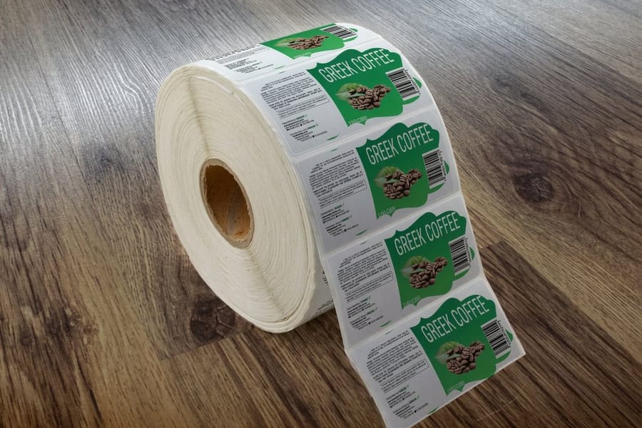 Shaped roll labels printed by 4OVER4 with a custom die-cut shape applied to packaging