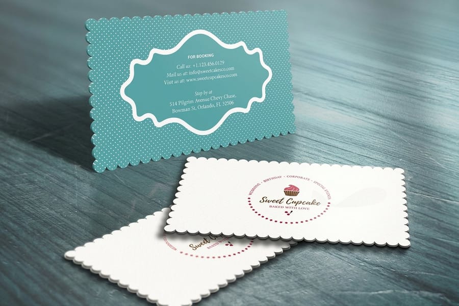Die-cut laminated business cards printed by 4OVER4 with a shaped edge and a laminated surface