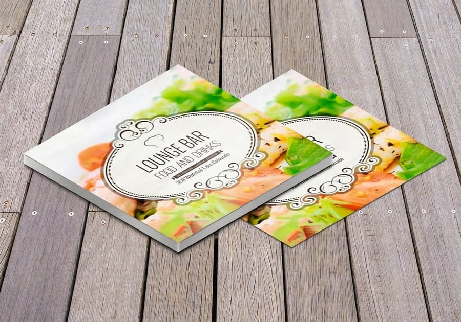 Custom drink coasters from 4OVER4 sitting on a taproom bar top