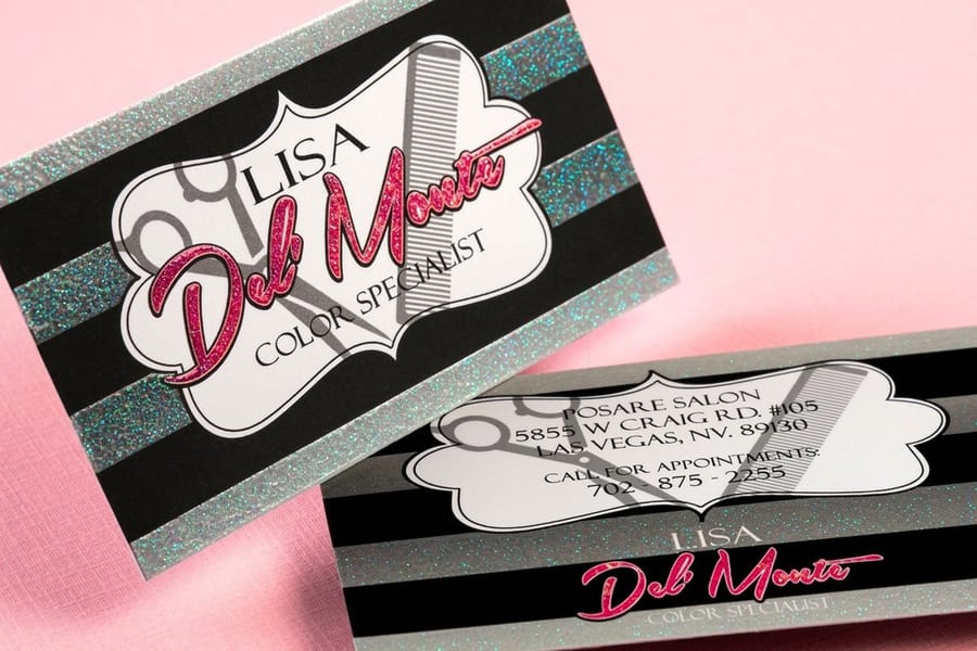 Glitter spot UV business cards showing crisp coated detail from 4OVER4