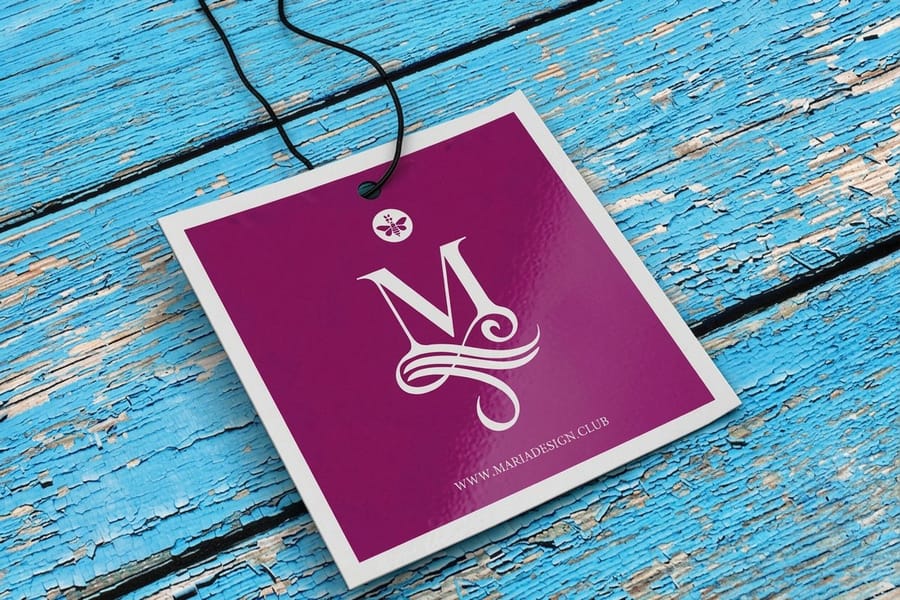 Gloss laminated hangtags printed by 4OVER4 with a high sheen surface catching the light