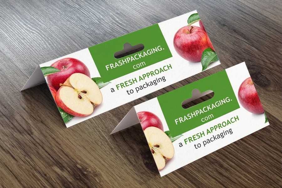 Header cards from 4OVER4 printed for a fresh produce brand, with a hang hole punched through the top