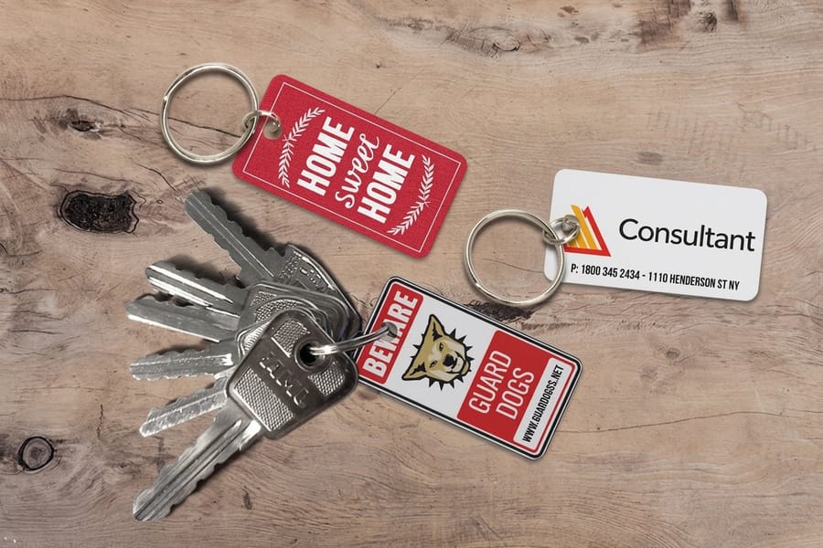Printed key tags by 4OVER4 with drilled holes ready for rings and loops