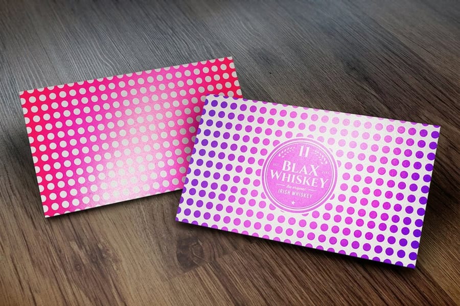 Metallic business cards from 4OVER4 with a stamped foil accent catching the light