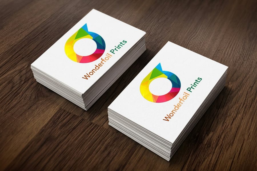 Metallic business card from 4OVER4 with a reflective printed logo