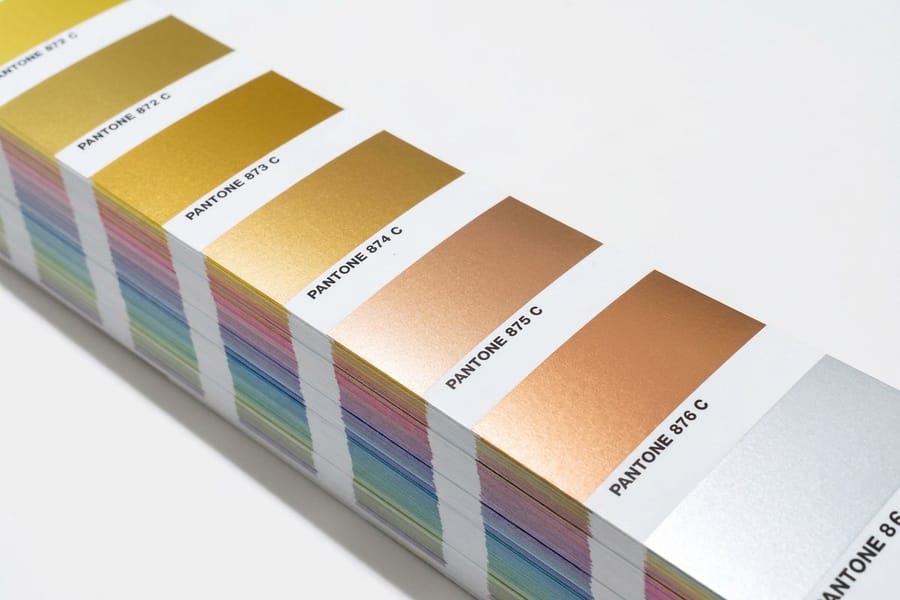 Foil stickers printed by 4OVER4 with solid stamped shapes and clear space around each mark