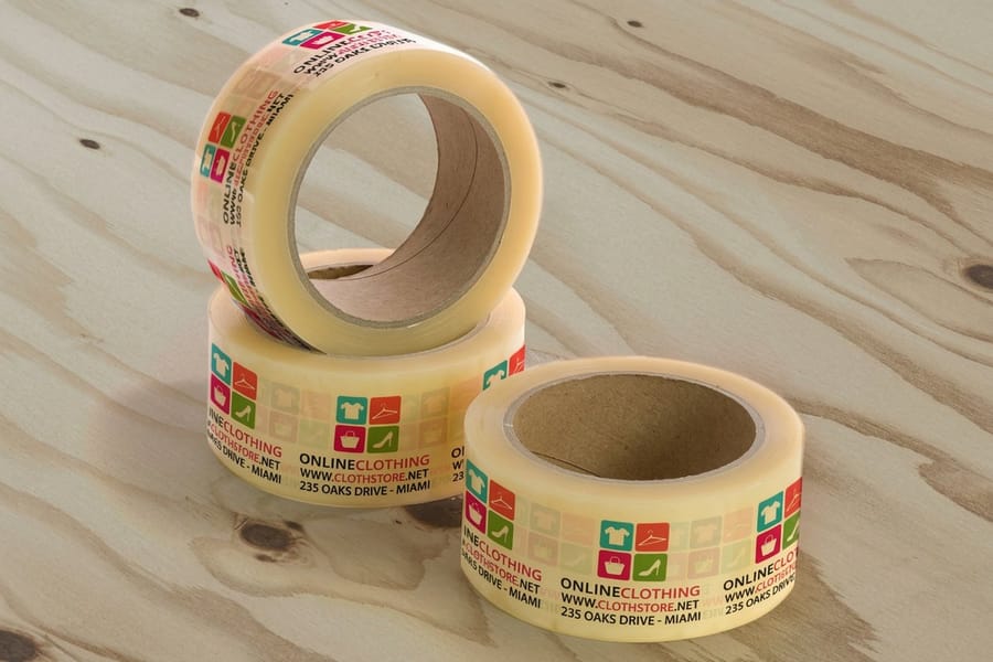 Custom printed packaging tape from 4OVER4 sealing a corrugated carton along the centre seam