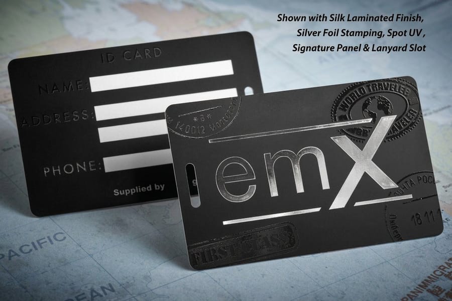 Plastic discount cards printed by 4OVER4 held to show the thickness of the 30mil stock