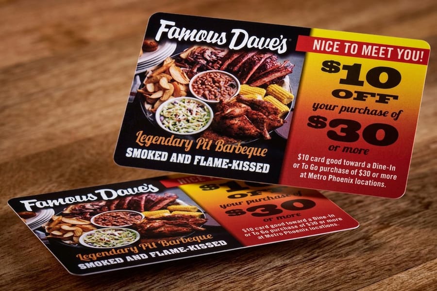 Plastic discount cards printed by 4OVER4 showing front and back layouts side by side