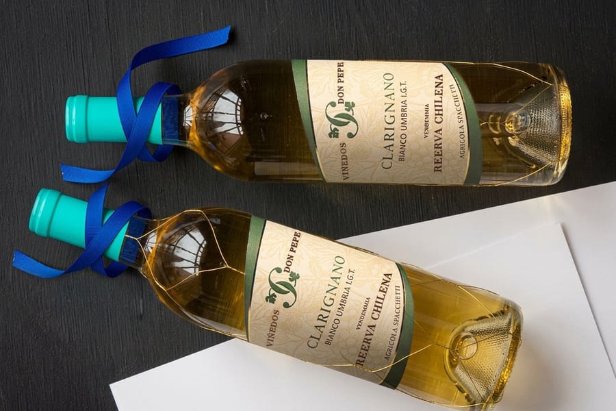 Shaped wine labels printed by 4OVER4 showing a die-cut shape on a bottle