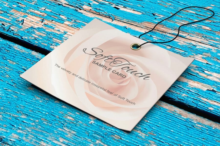 Soft touch hangtags printed by 4OVER4 tied with cord