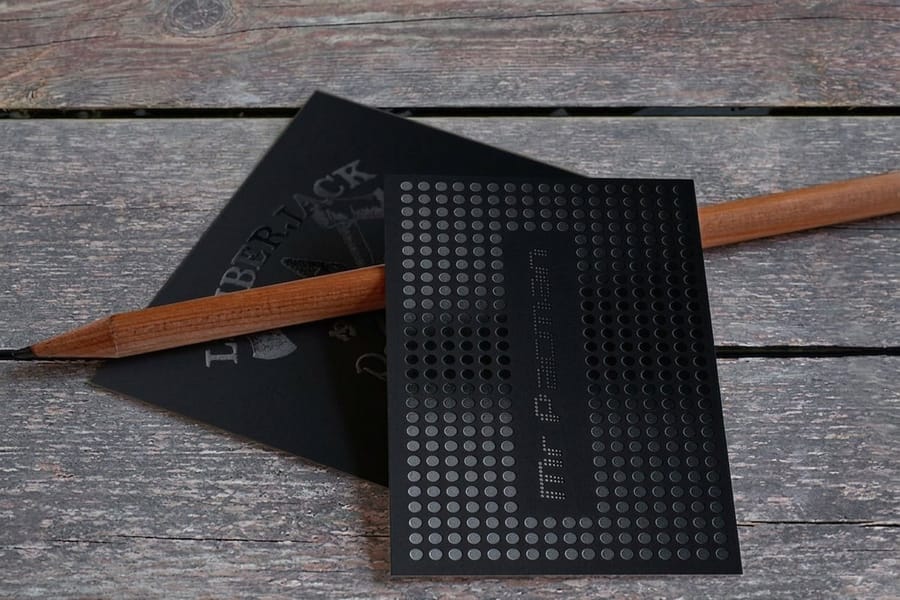 Spot UV business card with a crisp scannable code, printed by 4OVER4