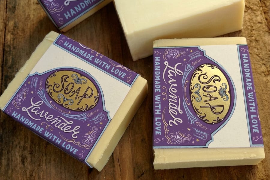 Soap labels printed by 4OVER4 shown as a wrap band sized to the girth of the bar