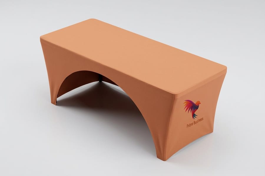 Custom stretch table cover with a centered logo at a trade show, printed by 4OVER4