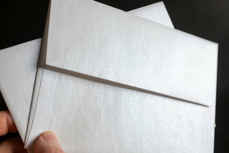 Ultra thick metallic pearl invitations printed by 4OVER4 on 26pt pearl stock with a matching envelope