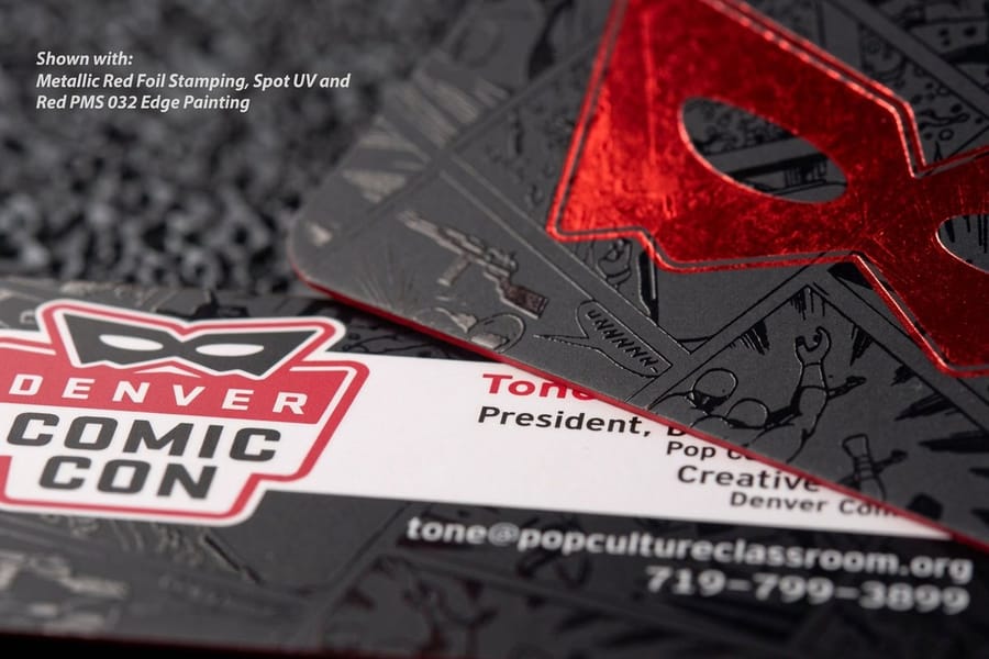 Water beading on a silk laminated business card showing its water resistance, from 4OVER4.COM